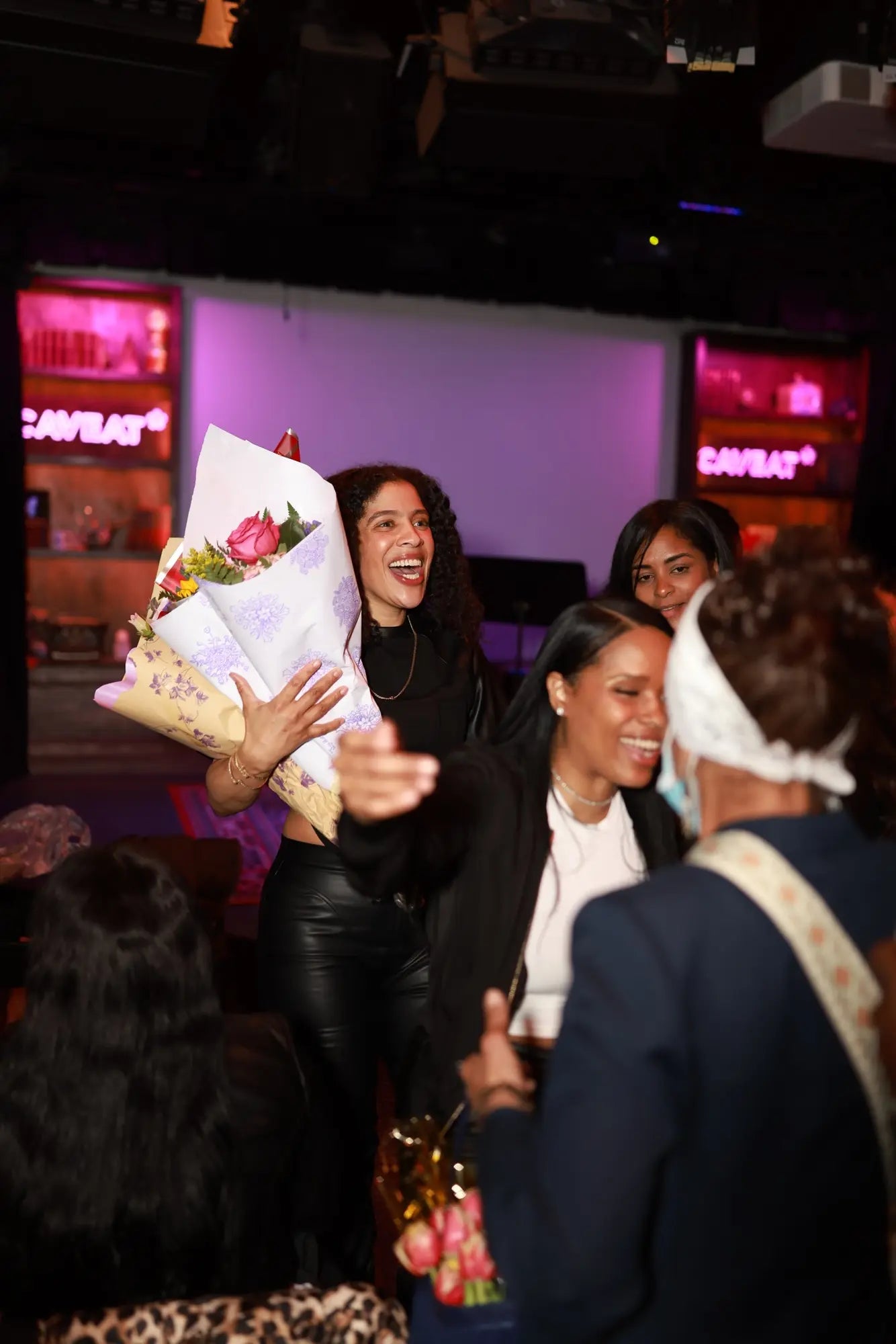 Danielle Alonzo celebrating with flowers after the performance
