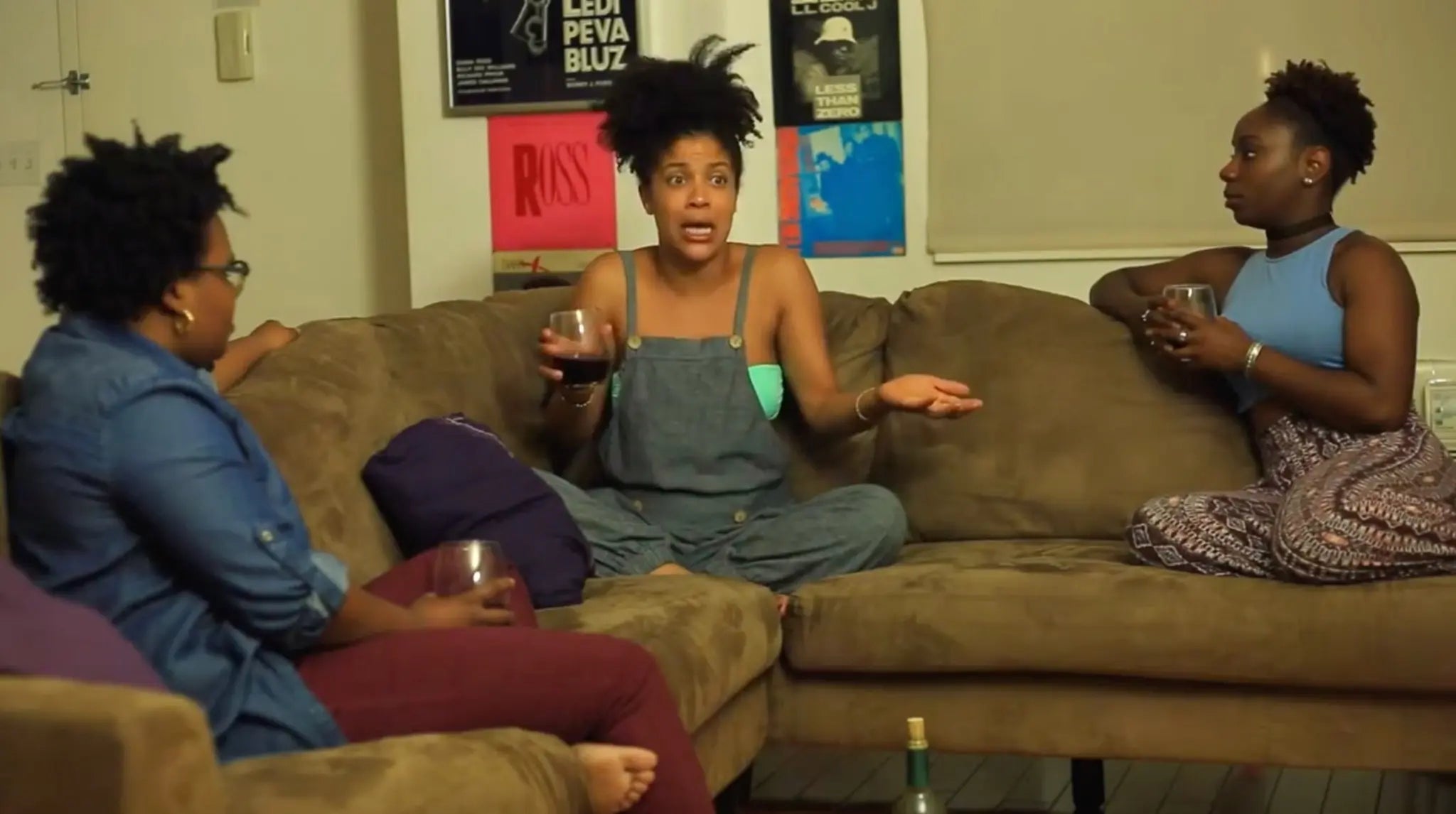 Danielle Alonzo centered in a scene with two women